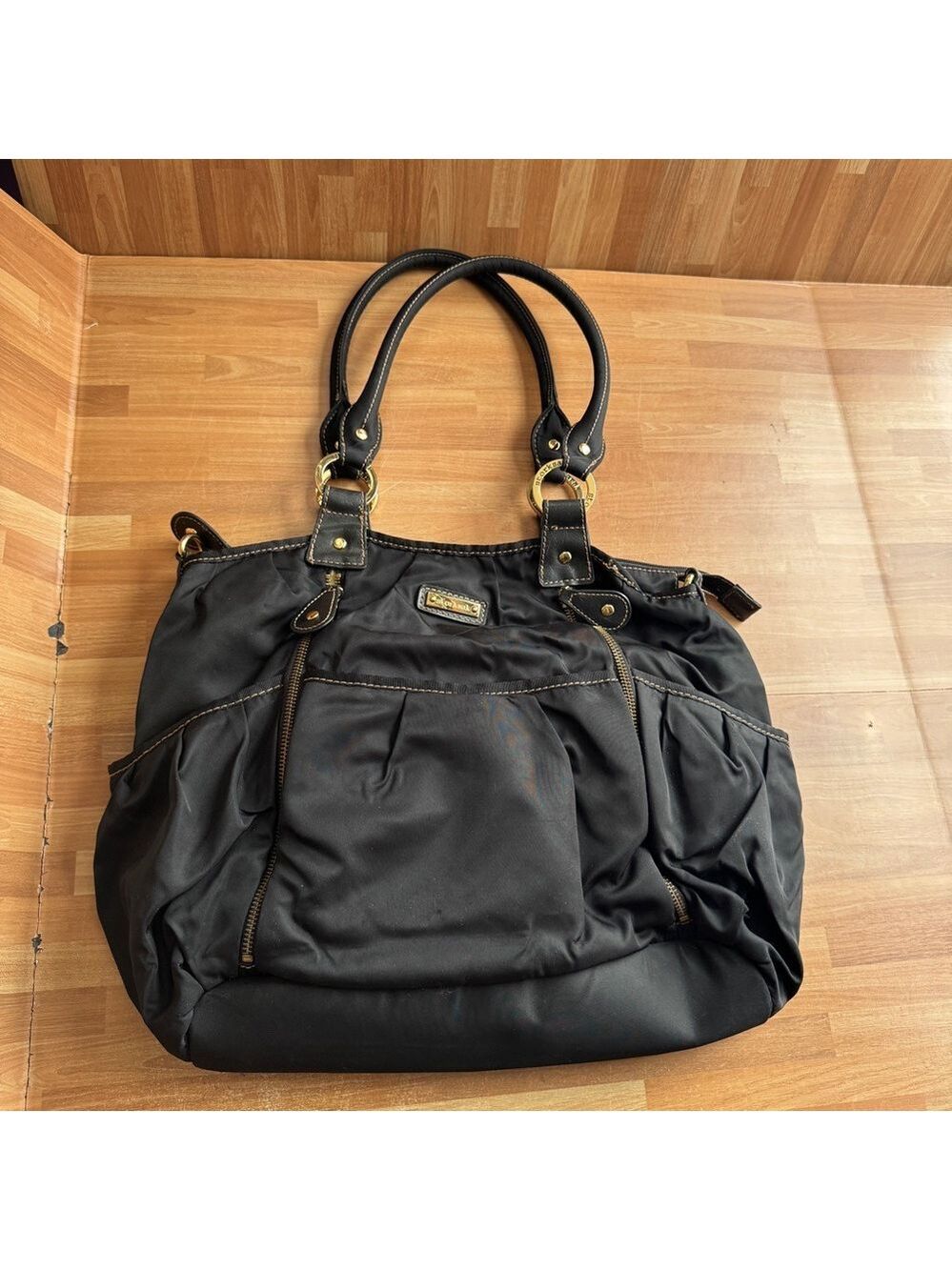 Storksak al Olivia diaper bag,black satin nylon,faux leather trim,gold-tone